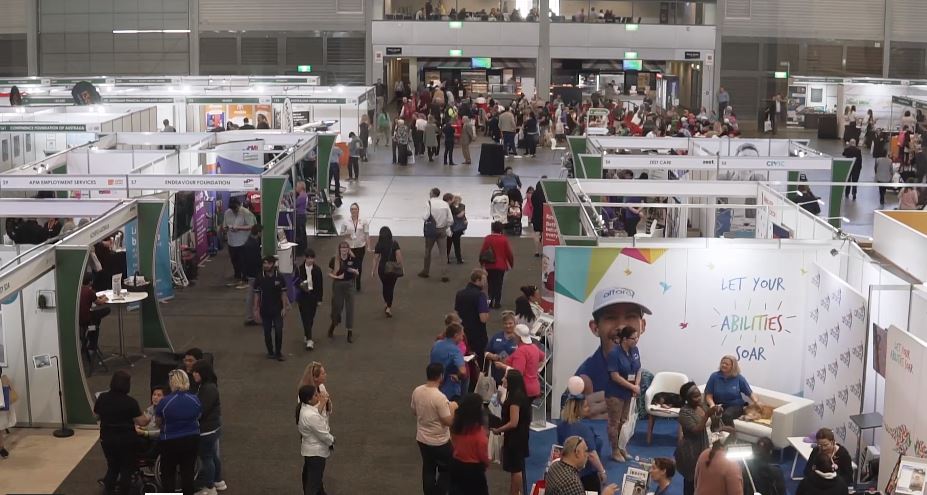 Crowd of people with expo stalls