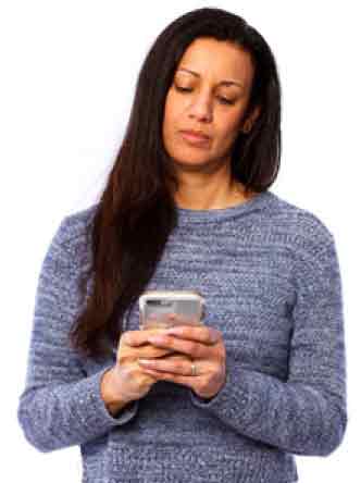woman looking at her mobile phone